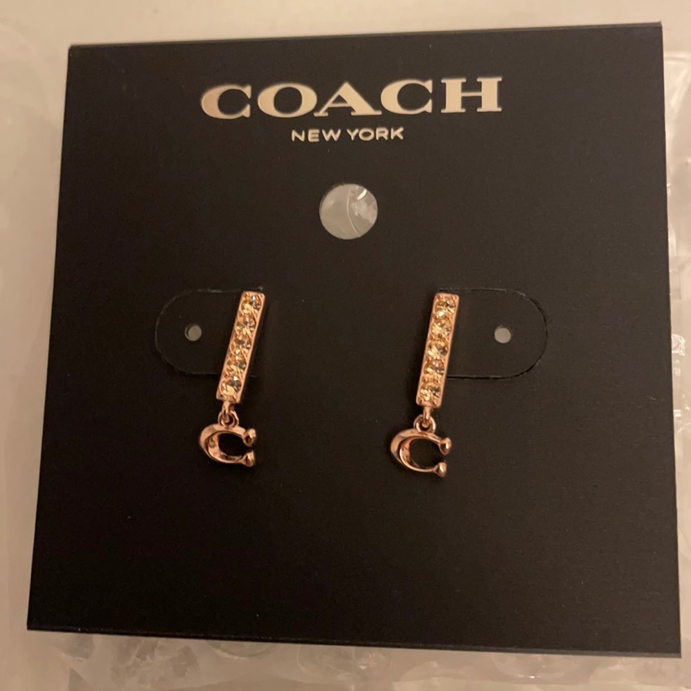 New Coach rose gold small earrings.
